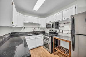 Kitchen featuring stainless steel appliances, and lots of storage