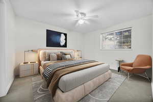 En-suite Bedroom featuring daylight iinterior, light colored carpet and ceiling fan