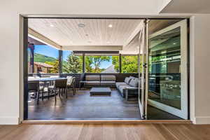 Interior space with hardwood / wood-style floors, wood ceiling, and a mountain view