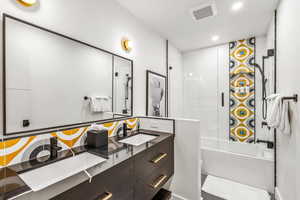 Bathroom featuring vanity, independent shower and bath, and tile patterned floors