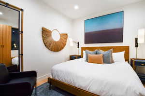 Bedroom with wood-type flooring