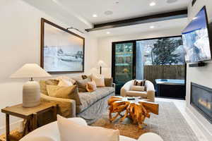 Living room featuring beam ceiling