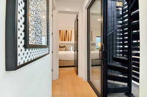 Hallway featuring light wood-type flooring