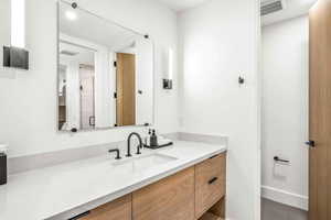 Bathroom featuring vanity and tile patterned floors