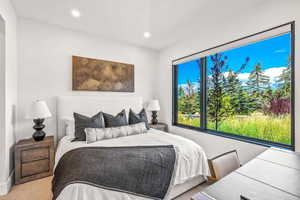 Bedroom with light colored carpet