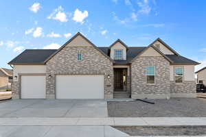 View of front facade featuring a garage