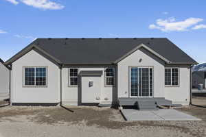 Rear view of house featuring a patio area