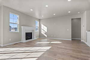 Unfurnished living room with light hardwood / wood-style flooring