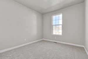 Spare room with carpet flooring