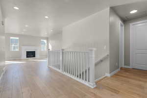 Hall with light hardwood / wood-style floors