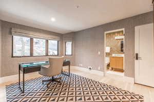 Home office featuring hardwood / wood-style floors