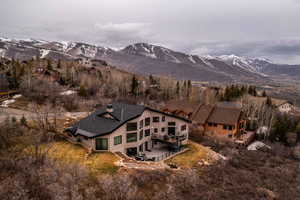 Birds eye view of property with a mountain view