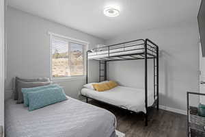 Bedroom featuring dark wood-type flooring