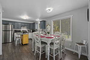 Dining area featuring a textured ceiling and dark hardwood / wood-style flooring