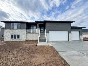 View of front of property with a garage