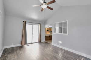 Empty room with a textured ceiling, wood-type flooring, high vaulted ceiling, and ceiling fan