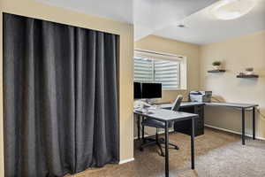 View of carpeted home office