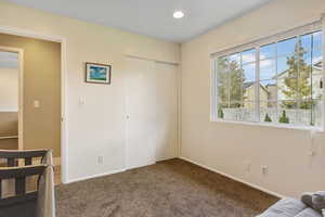 Bedroom featuring a closet and carpet