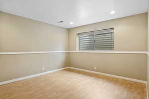 Empty room featuring light wood-type flooring