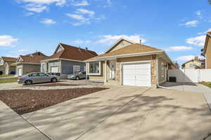 View of front facade featuring a garage