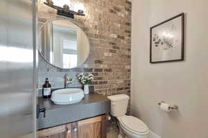 Bathroom with toilet and vanity