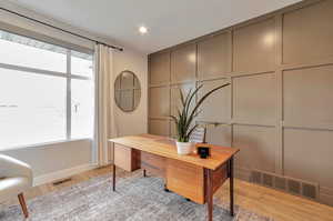 Office space featuring light hardwood / wood-style floors