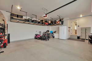 Garage with a garage with epoxy flooring