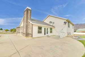 Rear view of property featuring a patio