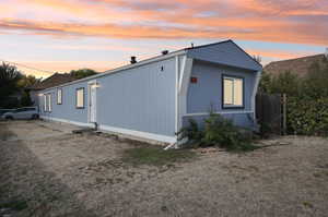 View of property exterior at dusk