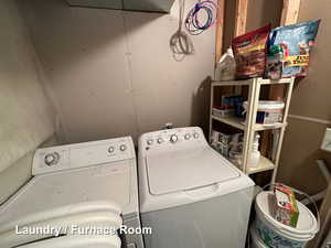 Laundry room featuring washer and clothes dryer