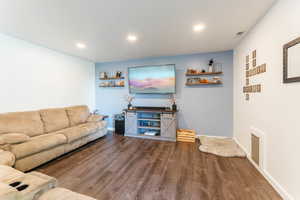 Living room featuring wood-type flooring