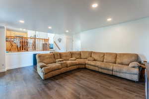 Living room featuring dark wood-type flooring