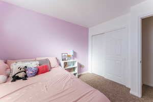 Bedroom featuring a closet and carpet floors