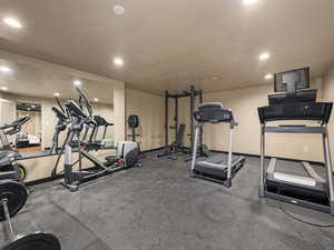 Gym with a textured ceiling