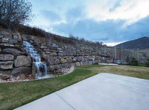 View of yard featuring a patio area and a mountain view