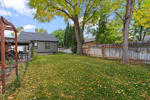 View of yard with a covered patio.