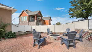 Firepit and Large Sandbox to the Left.Side Gate to Access the Front