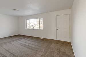 View of carpeted spare room