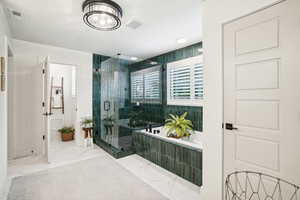 Bathroom featuring plus walk in shower