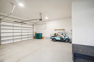 Garage featuring a garage door opener