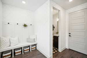 Mudroom with dark wood-type flooring