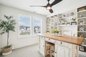 Office featuring ceiling fan and light colored carpet