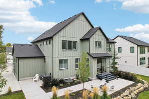 Rear view of property featuring a patio