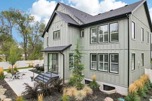 Rear view of property featuring a patio area