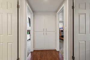 Hall featuring dark hardwood / wood-style flooring