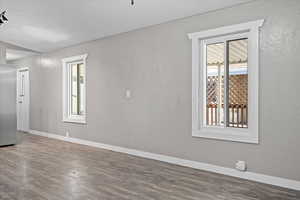 Unfurnished room featuring wood-type flooring