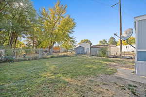 View of yard featuring a storage shed