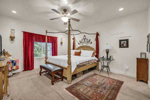 Bedroom featuring ceiling fan and light carpet