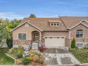 View of front of home featuring a garage