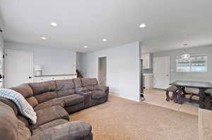 Living room featuring light carpet